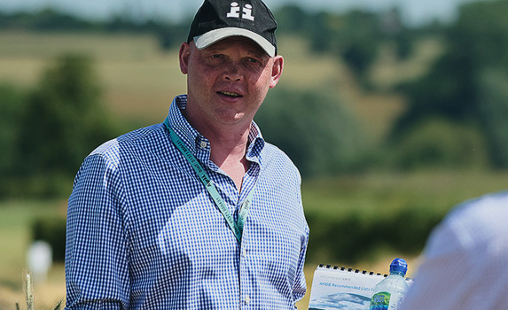 Seed Technical Manager Discussing Crop Varieties and Genetics with Farmers